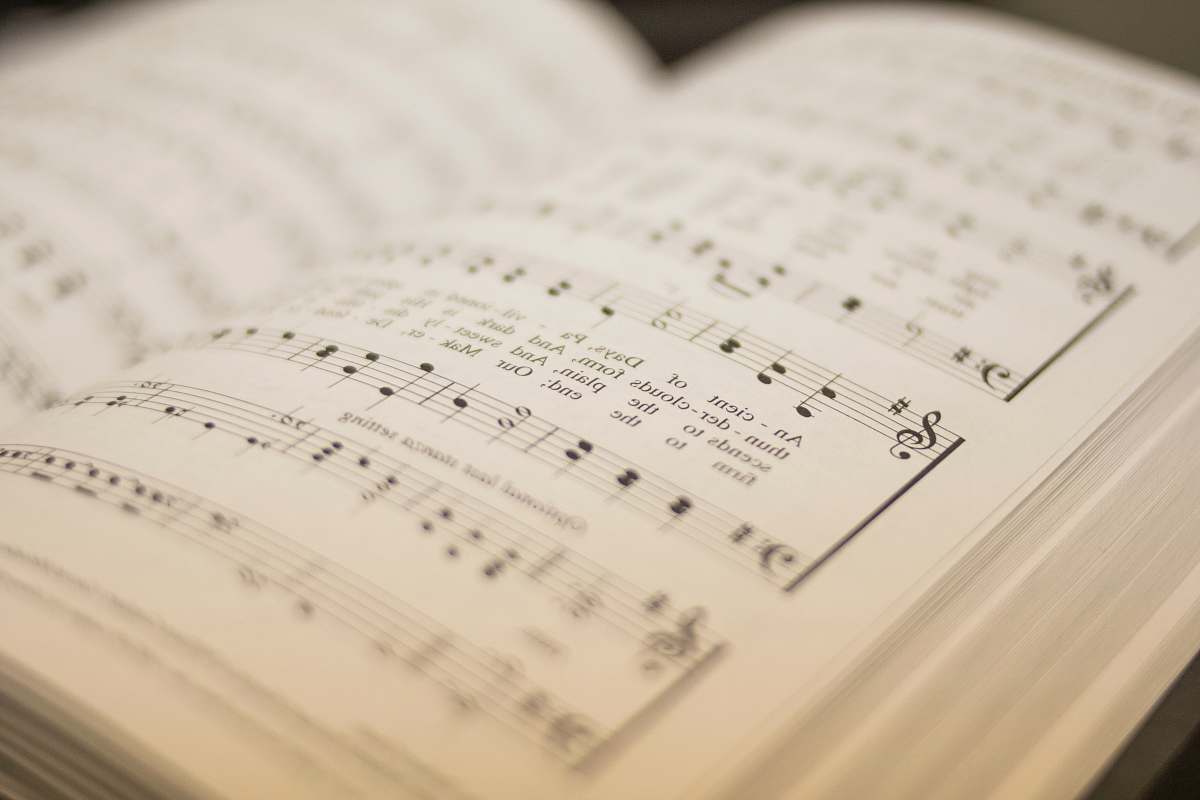 leisure activities shallow focus photography of musical note book sheet music